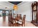 Elegant dining room with a wood table and access to other rooms at 9154 Snow Hill Ct, Charlotte, NC 28269