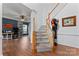 Bright entryway with hardwood floors and a staircase leading upstairs at 9154 Snow Hill Ct, Charlotte, NC 28269