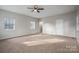 Large bedroom with neutral walls, carpet, and a ceiling fan at 121 Pam Dr, Gastonia, NC 28056
