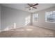 Spacious bedroom with neutral walls, carpet, and ample natural light at 121 Pam Dr, Gastonia, NC 28056