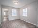 Empty bedroom with neutral walls and wood-look flooring at 121 Pam Dr, Gastonia, NC 28056
