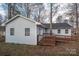 Rear exterior view of a single-story home with wooden deck and ramp access at 121 Pam Dr, Gastonia, NC 28056