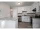 Updated kitchen with white cabinets, stainless steel appliances, and granite countertops at 121 Pam Dr, Gastonia, NC 28056