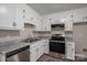 Updated kitchen with white cabinets, stainless steel appliances, and granite countertops at 121 Pam Dr, Gastonia, NC 28056