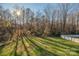 Spacious backyard with grassy area and wooded backdrop at 1350 Kensington Cir, Newton, NC 28658