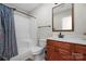 Basement bathroom with shower/tub combo and wood vanity at 1350 Kensington Cir, Newton, NC 28658