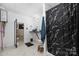 Basement bathroom with black and white marble shower and floating vanity at 1350 Kensington Cir, Newton, NC 28658