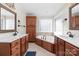 Bathroom with double vanity, soaking tub, and tile floor at 1350 Kensington Cir, Newton, NC 28658