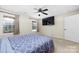 Spacious finished basement bedroom with large windows and ceiling fan at 1350 Kensington Cir, Newton, NC 28658