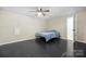 Simple finished basement bedroom with dark flooring and ceiling fan at 1350 Kensington Cir, Newton, NC 28658