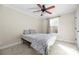 Bedroom with a ceiling fan and double doors at 1350 Kensington Cir, Newton, NC 28658