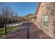 Large deck with brick home exterior and wooded backyard view at 1350 Kensington Cir, Newton, NC 28658