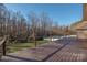 Deck overlooking fenced backyard with wooded backdrop at 1350 Kensington Cir, Newton, NC 28658
