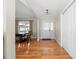 Light and airy entryway with hardwood floors leading to dining room at 1350 Kensington Cir, Newton, NC 28658