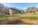 House exterior showcasing landscaping and a driveway at 1350 Kensington Cir, Newton, NC 28658