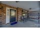 Front porch with seating and entry door at 1350 Kensington Cir, Newton, NC 28658