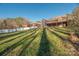 House back view, showcasing a large deck and wooded lot at 1350 Kensington Cir, Newton, NC 28658