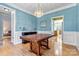 Formal dining room featuring hardwood floors and chandelier at 13521 Toka Ct, Huntersville, NC 28078