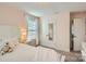 Serene bedroom with white bed frame and polka dot bedding at 137 Yellow Birch Loop, Mooresville, NC 28117