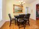 Dining room with hardwood floors, chandelier, and decorative painting at 141 Lilac Mist Loop # 109, Mooresville, NC 28115