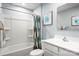 A second bathroom with white fixtures, shower/tub combo, and decorative wall art at 1705 Gutter Branch Dr, Charlotte, NC 28216