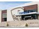 Topgolf facility entrance with modern design and steps leading up at 1705 Gutter Branch Dr, Charlotte, NC 28216