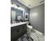 Stylish bathroom with dark gray vanity, marble tile floor, and contemporary fixtures at 2791 Round Hill Rd, Rock Hill, SC 29730