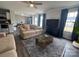 Living room with a ceiling fan, couch, wood floors, and view of dining area and kitchen at 2791 Round Hill Rd, Rock Hill, SC 29730