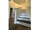 View of the staircase with dark wood treads and white risers at 2791 Round Hill Rd, Rock Hill, SC 29730