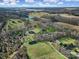 Aerial view of a house and expansive property with fields and trees at 29162 Pennington Rd, Albemarle, NC 28001