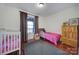 Cozy bedroom with crib and wooden wardrobe at 29162 Pennington Rd, Albemarle, NC 28001