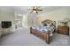 Spacious bedroom with wooden bed frame and dresser at 29162 Pennington Rd, Albemarle, NC 28001