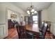 Formal dining room featuring hardwood floors and elegant light fixture at 29162 Pennington Rd, Albemarle, NC 28001