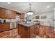 Spacious kitchen with island, granite countertops, and hardwood floors at 29162 Pennington Rd, Albemarle, NC 28001