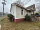 Front and side view of the house with a small porch at 3042 N Oxford St, Claremont, NC 28610