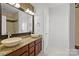 Bathroom with double vanity, tile backsplash, and modern fixtures at 3957 Picasso Ct, Charlotte, NC 28205