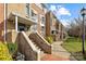 Front walkway and entrance to a brick and stone multi-story condo building at 3957 Picasso Ct, Charlotte, NC 28205