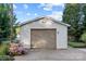 Detached garage with a paved driveway and landscaping at 401 Stokes Ave, Clover, SC 29710