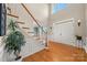 Bright entryway with hardwood floors and a grand staircase at 5225 Firebrick Sw Ln, Concord, NC 28025