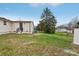 Back view of house with grassy backyard at 725 Shannon Bradley Rd, Gastonia, NC 28052