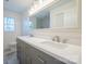 Updated bathroom with double vanity, gray cabinets, and a large mirror at 1254 Huckleberry Dr, Lincolnton, NC 28092