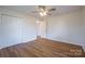 Bedroom with wood floors, double doors, and ceiling fan at 1254 Huckleberry Dr, Lincolnton, NC 28092