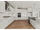 White kitchen with stainless steel appliances, double oven, and ample counter space at 128 Balboa St # 25, Matthews, NC 28104