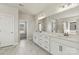Modern main bathroom featuring dual vanity, white cabinets, and marble tile flooring at 128 Balboa St # 25, Matthews, NC 28104