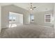 Spacious main bedroom with vaulted ceiling, plush carpet, and natural light at 128 Balboa St # 25, Matthews, NC 28104