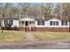 Ranch home with white siding, brick accents, and stone walkway at 1370 Poole Rd, Salisbury, NC 28146