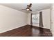 Spacious bedroom featuring hardwood floors and a ceiling fan at 14331 Lyon Hill Ln, Huntersville, NC 28078