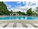 Community swimming pool with lounge chairs at 14331 Lyon Hill Ln, Huntersville, NC 28078