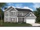 Exterior elevation of a two-story gray home with white trim, a two-car garage, and landscaping at 204 Balboa St # 20, Matthews, NC 28104