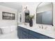 Bathroom with dual vanity sinks, a soaking tub, and stylish arched mirror at 4014 Avalon Ave, Charlotte, NC 28208